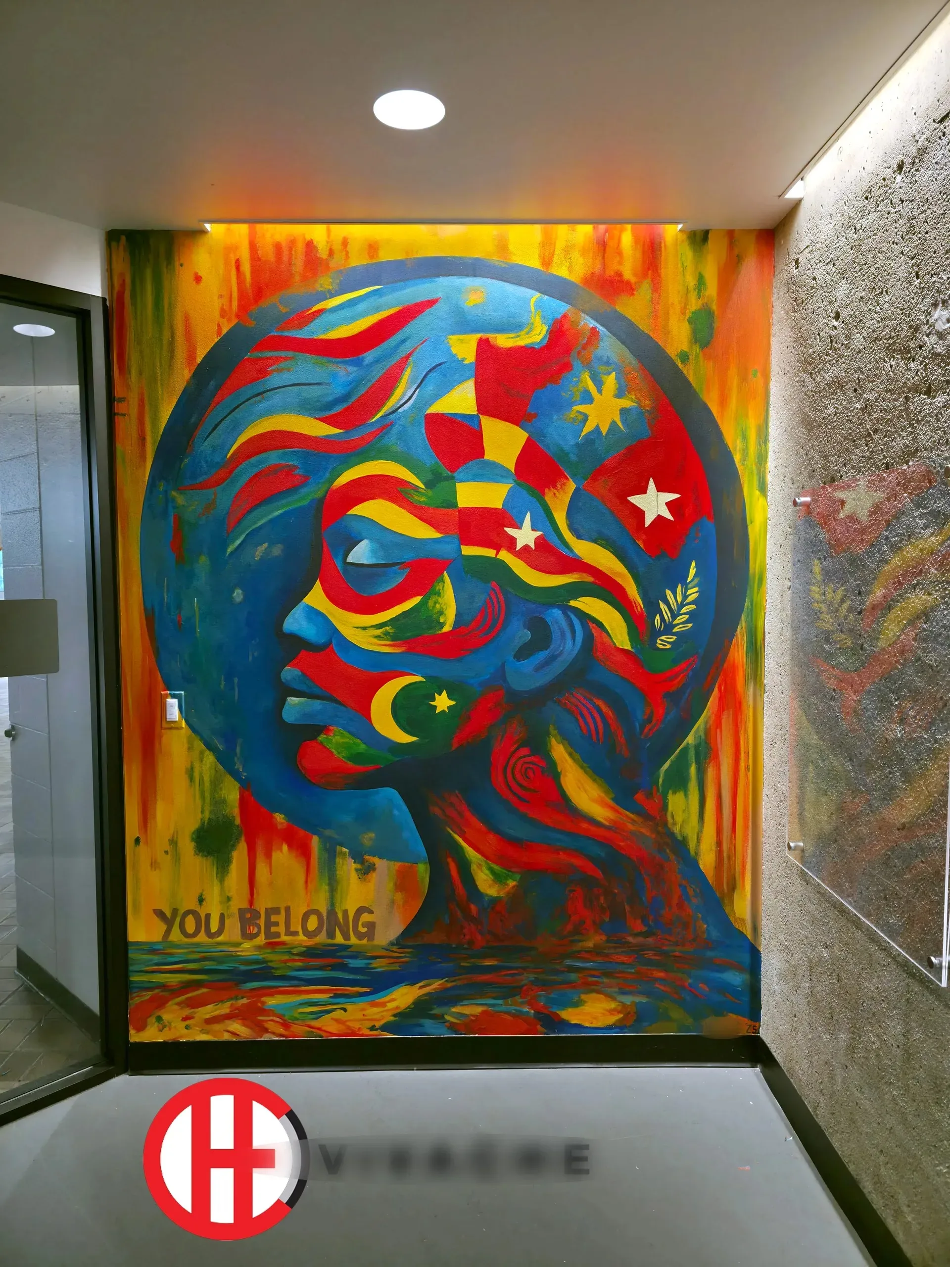 You Belong . A vibrant surrealist mural that combines a female face with celestial and natural elements, creating a dreamlike atmosphere