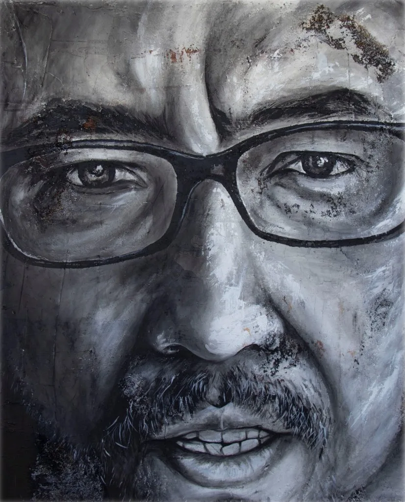High-contrast portrait in black and white emphasizing facial